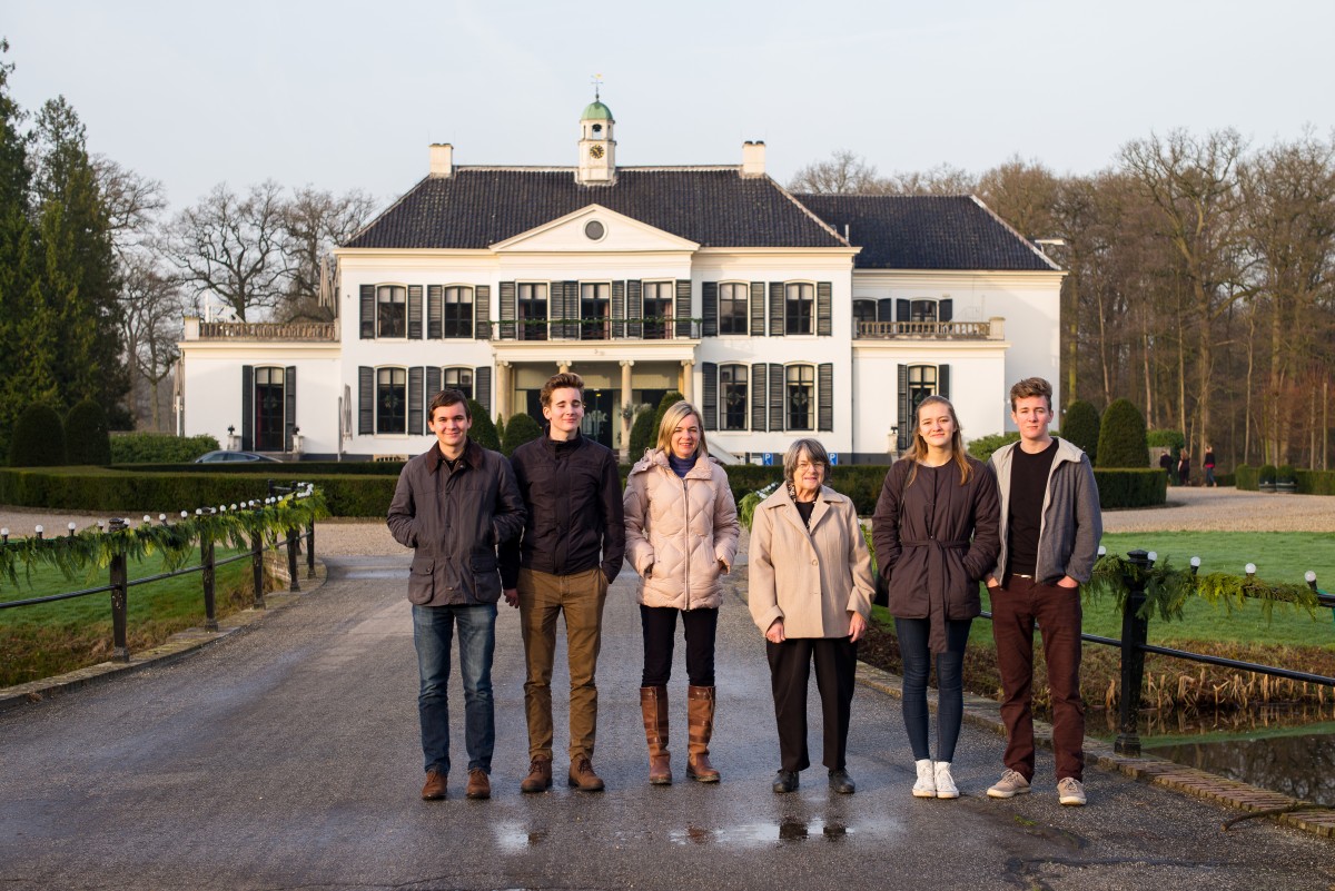 generations in front of a house co-ownership of house